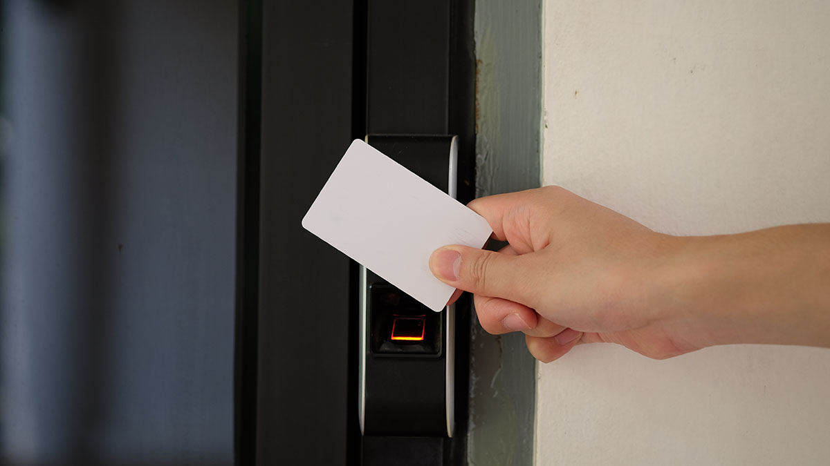 Door Access Control With A Hand Inserting Key Card To Unlock Doo