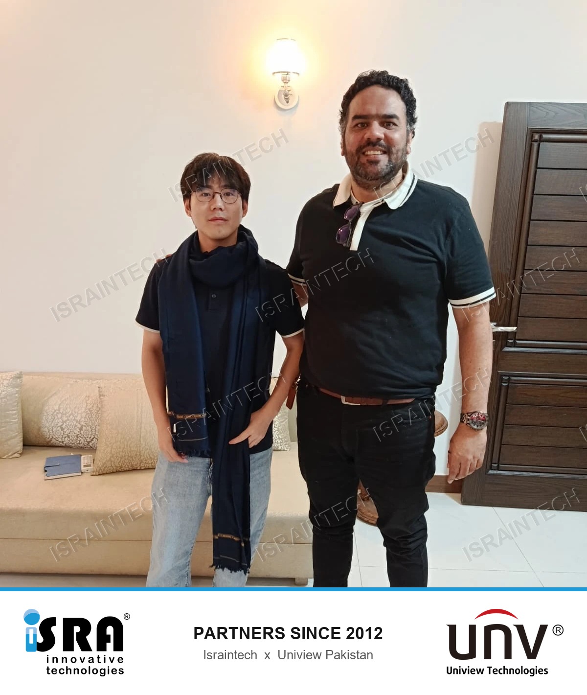 the Country Manager of Uniview Pakistan wearing the shawl presented by Adnan Shafiq of Israintech