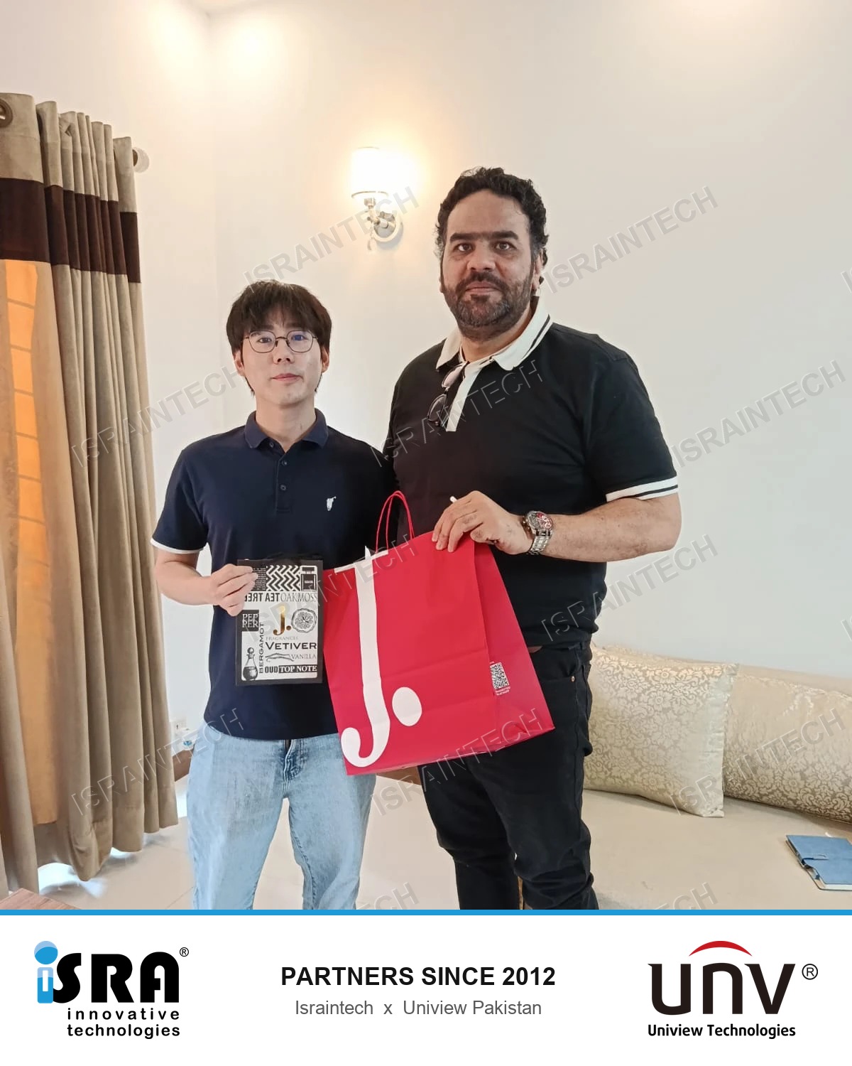 Adnan Shafiq of Israintech with the Country Manager of Uniview Pakistan, exchanging gifts at the Uniview office
